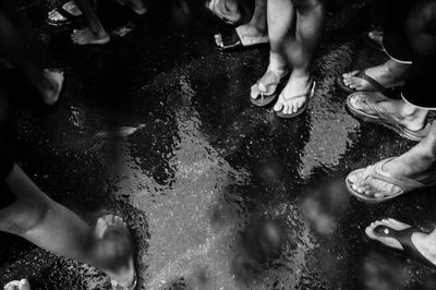 Low section of people standing in water