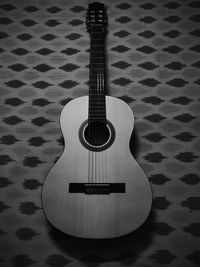 Close-up of guitar on wall at home