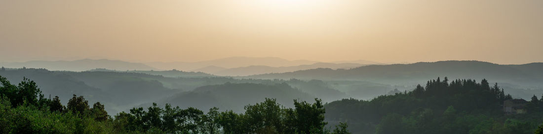 Scenic view of mountains against sky during sunset