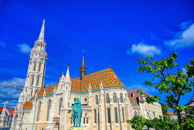 Low angle view of temple building against cloudy sky