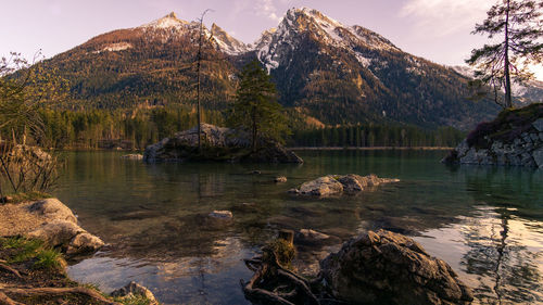 Scenic view of lake and mountains against sky