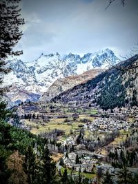 Scenic view of snowcapped mountains against sky