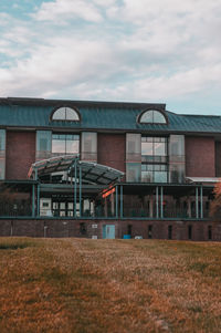 Abandoned house on field against sky