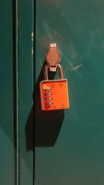 Close-up of padlocks hanging on metal pole