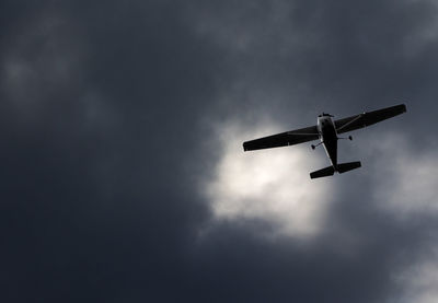 Low angle view of airplane in sky