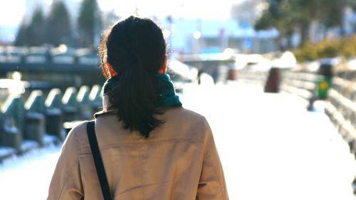 Rear view of woman in city