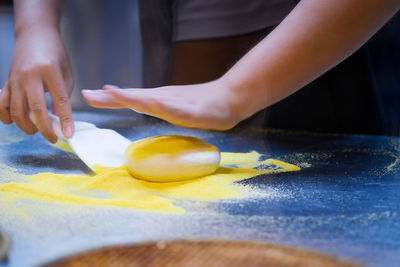 Close-up of person preparing food