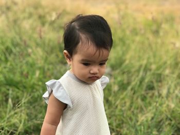 Portrait of cute boy standing outdoors