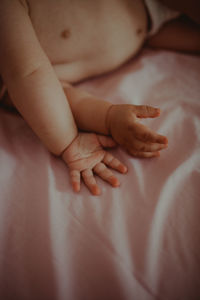 High angle view of baby boy lying on bed