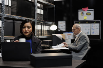 Businesswoman using digital tablet in office