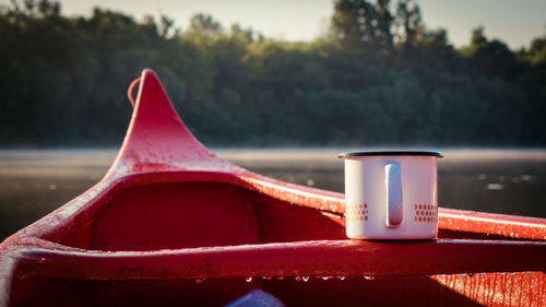 Close-up of red water against trees