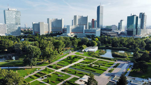 Aerial view of modern buildings in city against sky