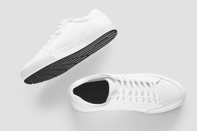 Close-up of shoes against white background
