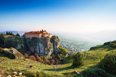 Panoramic view of castle on mountain against sky