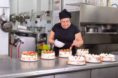 Midsection of man preparing food