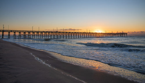 Scenic view of sea against clear sky during sunset