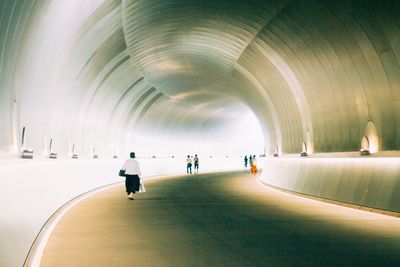 People walking in tunnel