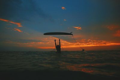 Man with surfboard in sea