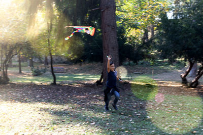 Rear view of man and woman in park