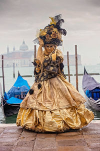 View of boat in canal and a woman 