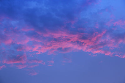 Low angle view of dramatic sky during sunset