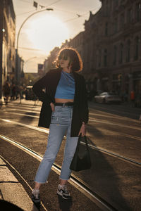 Rear view of woman standing in city