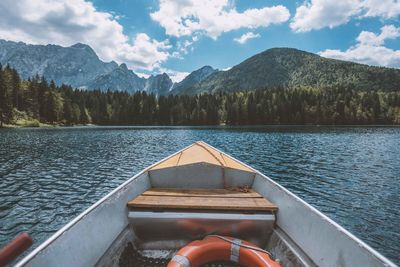 Scenic view of lake in forest against sky