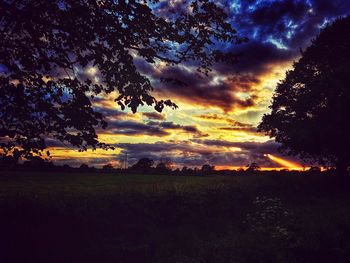 Scenic view of landscape against cloudy sky