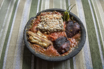 High angle view of food in earthenware bowl on table