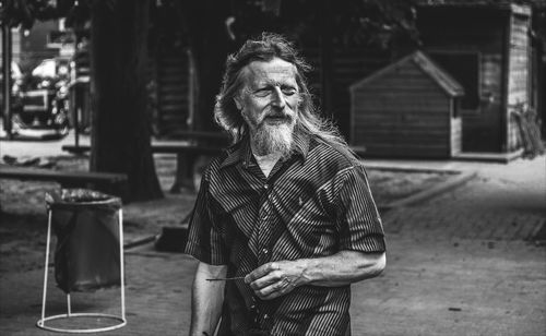 Senior man walking on footpath