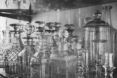 Close-up of various glass containers on table