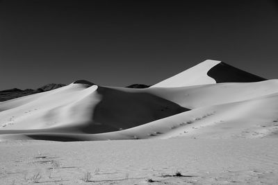 Scenic view of desert against clear sky