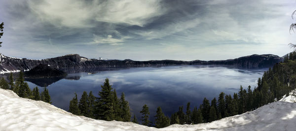 Scenic view of mountains against cloudy sky