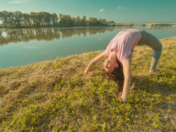 Side view of boy in lake