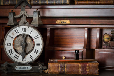 Close-up of clock on table