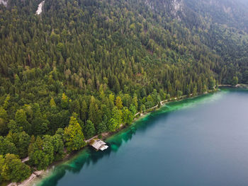 German wooden summer house overlooking scenic lake at mountains. bavarian alps.