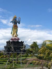 Low angle view of statue against sky