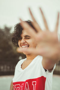 Portrait of a smiling young woman standing outdoors