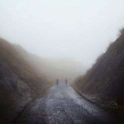 Scenic view of mountains in foggy weather