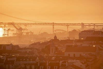 Low angle view of bridge against sky during sunset