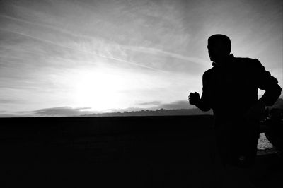 Silhouette of people at sunset