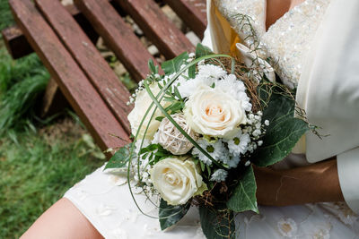 High angle view of white rose bouquet on table