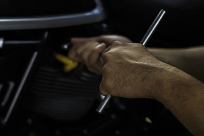 High angle view of man repairing car