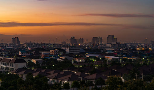 High angle view of buildings against sky during sunset