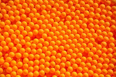Full frame shot of orange table tennis balls