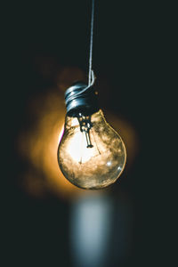 Close-up of illuminated light bulb