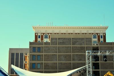 Low angle view of building against clear blue sky