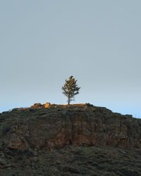 Low angle view of rock formation against clear sky