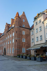 Low angle view of buildings against clear sky