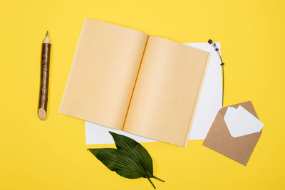 Close-up of book on yellow paper